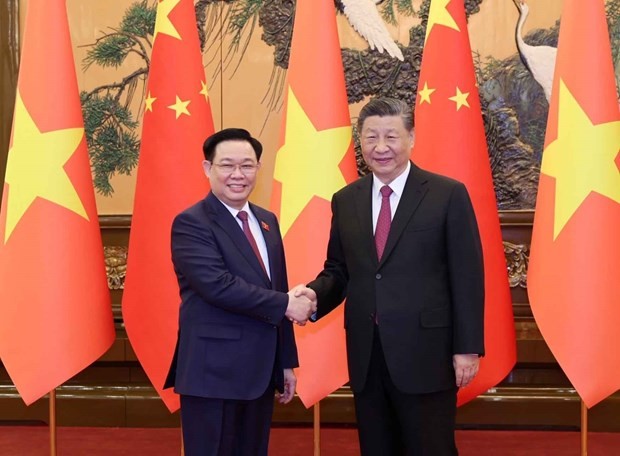 越南国会主席王廷惠与会见中共中央总书记、中华人民共和国主席习近平。（图：越通社）