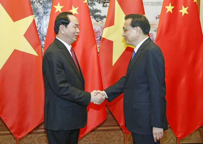 President Tran Dai Quang (left) yesterday met with Chinese Premier Li Keqiang in Beijing during his State visit to China. (Photo: VNA/VNS)