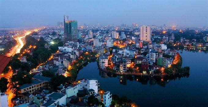 Hanoi at dusk. The investment and business environment have been improved to help develop the capital city. (Photo: VNA/VNS)