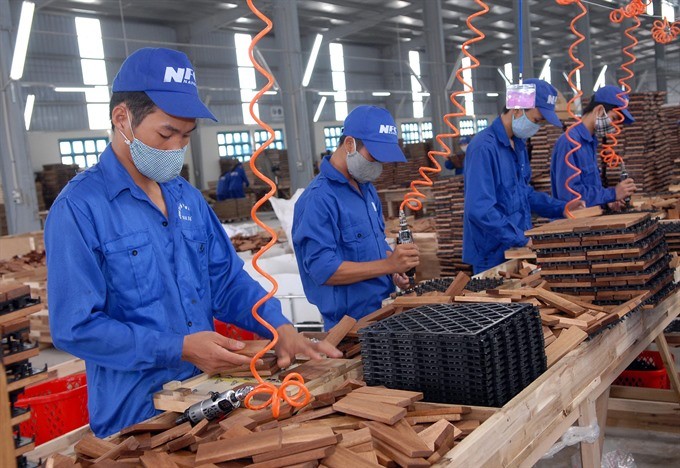 A wood processing line at the Nam Dinh Forest Product Joint Stock Company at Bao Minh Industrial Park. The wood sector is expected to surpass its export target this year. (Photo: VNA/VNS)