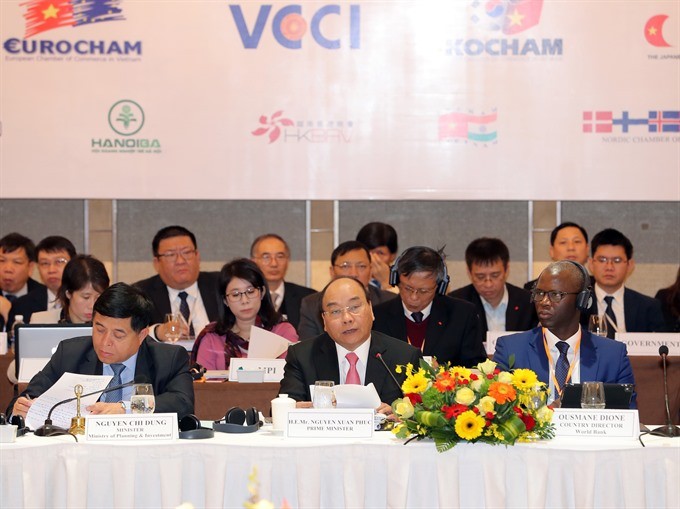 Prime Minister Nguyen Xuan Phuc pledged favourable conditions for businesses at the Vietnam Business Forum in Hanoi on Tuesday. (Photo: VNA/VNS)