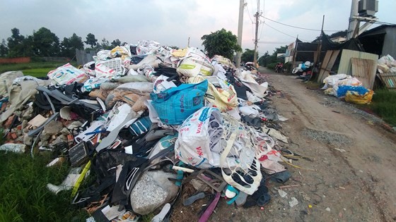 Industrial waste sneakily dumped in a road in Vinh Loc A commune, Binh Chanh district