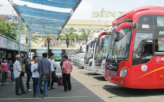 Passengers at a coach station in HCMC