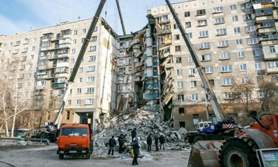 The rubble of the partially collapsed apartment building