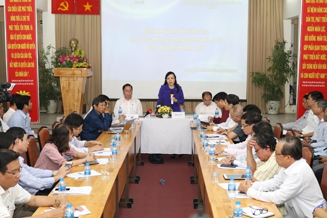 Health Minister Nguyen Thi Kim Tien (standing) speaks at the working session with HCM City's Health Department (Photo: VNA)