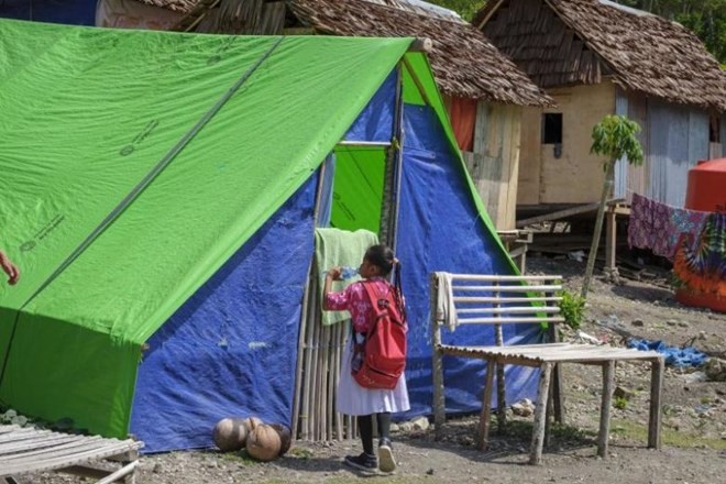 An Indonesian child outside her makeshift shelters. Some 6,000 children are still homeless six months after a devastating earthquake and tsunami hit Indonesia’s Palu city in September 2018. (Photo: AFP)