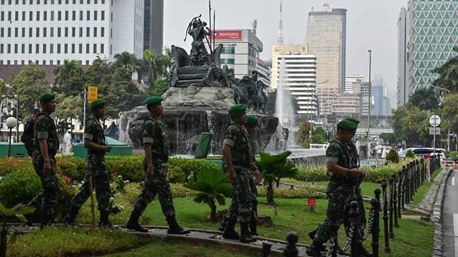 Indonesian soldiers patrol near the constitutional court in Jakarta on Jun 14, 2019, as the court hears a defeated presidential challenger's claim that Indonesia's 2019 election was rigged, allegations that spawned deadly rioting last month. (Photo: AFP)
