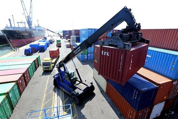 A container is loaded at Chu Lai Port in Quang Nam Province. Vietnam lacks a well-connected logistics network which can boost agricultural product trade and export. (Photo: VNA)