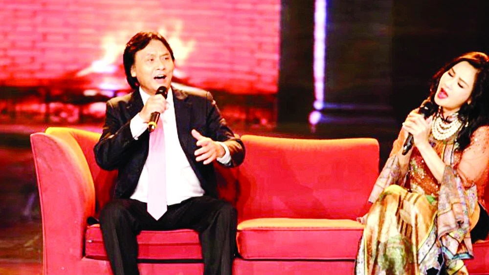 Ca sĩ Quang Lý cùng ca sĩ Thanh Lam trong một chương trình âm nhạc