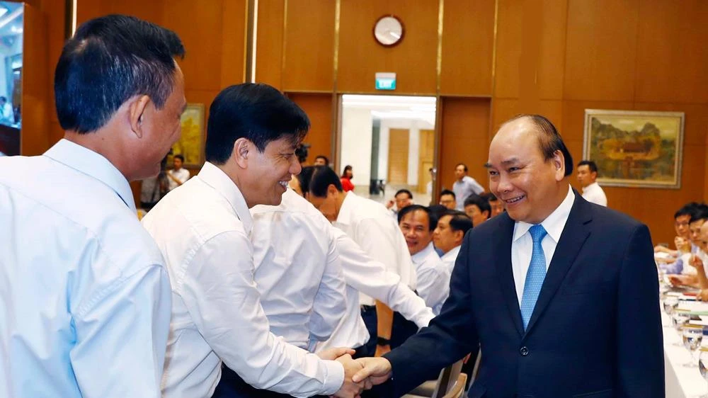 Thủ tướng Nguyễn Xuân Phúc, Chủ tịch Ủy ban Quốc gia Chính phủ điện tử và các đại biểu dự hội nghị. Ảnh: TTXVN