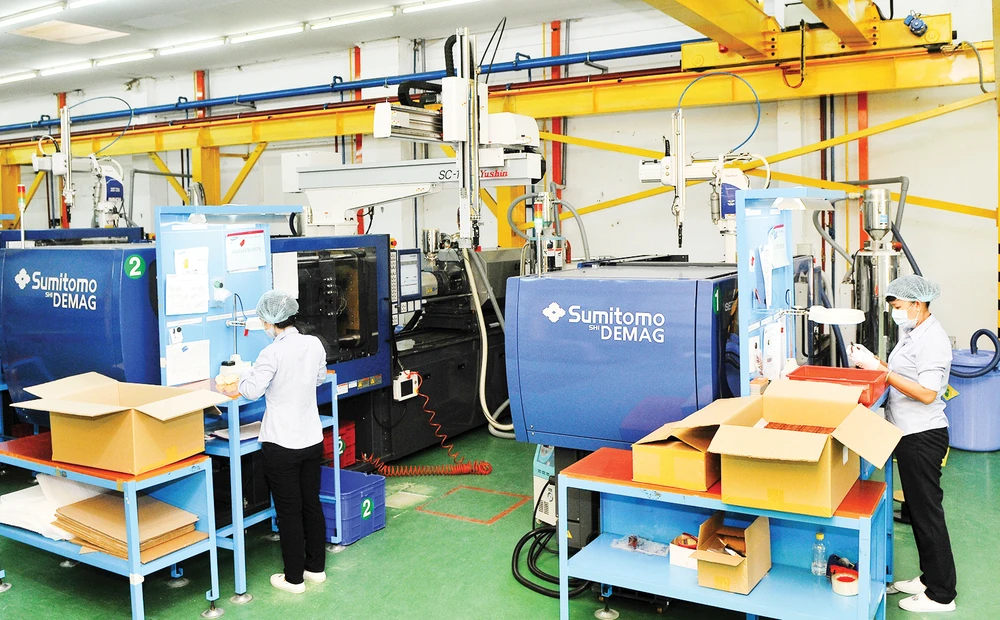 Sản xuất sản phẩm nhựa kỹ thuật cao tại Tổng công ty Công nghiệp Sài Gòn. Ảnh: CAO THĂNG