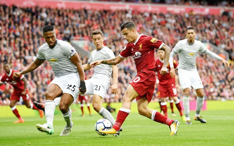 Liverpool (đỏ) chia điểm với Man.United. Ảnh: Getty Images
