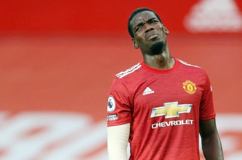 Paul Pogba và dáng vẻ thất vọng trong thảm bại 1-6 trước Tottenham. Ảnh: Getty Images