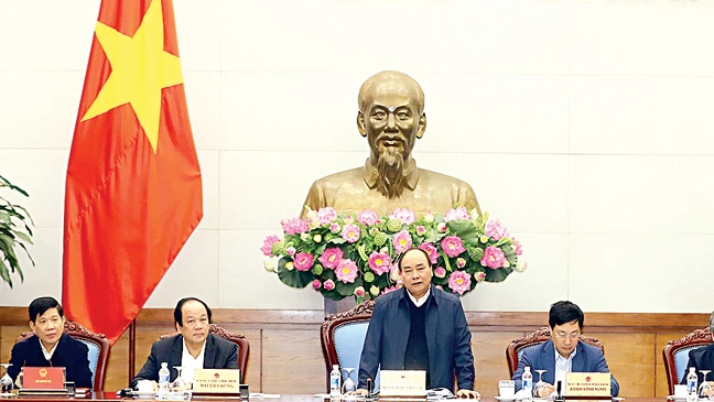 Thủ tướng Nguyễn Xuân Phúc phát biểu chỉ đạo tại Hội nghị tổng kết quan hệ Việt Nam - Lào năm 2017 và triển khai phương hướng hợp tác năm 2018 Ảnh: TTXVN 