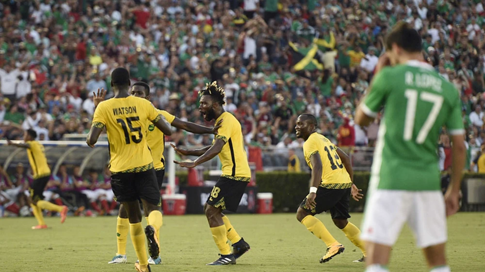 Các cầu thủ Jamaica ăn mừng sau khi ghi bàn. Ảnh: Reuters