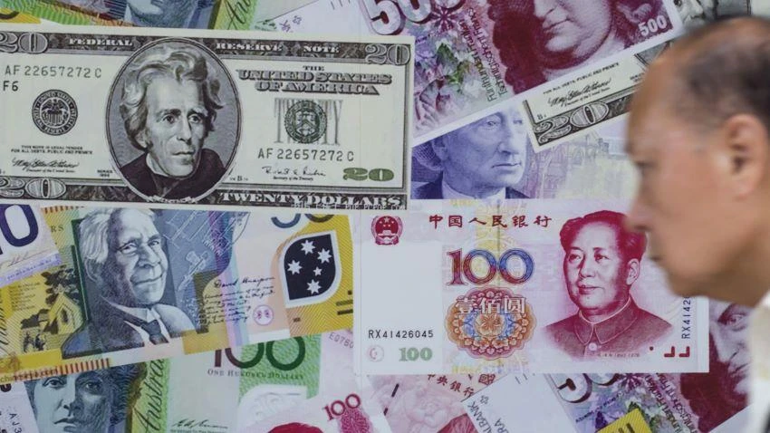 Spot rates for the yuan slid to 7.0536 against the dollar on Tuesday, as more investors sold the Chinese currency. © Reuters