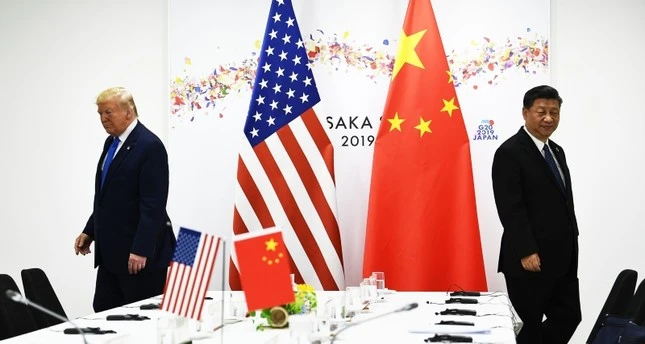 In this file photo taken on June 29, 2019 Chinese President Xi Jinping (R) and US President Donald Trump attend their bilateral meeting on the sidelines of the G20 Summit in Osaka. (AFP Photo)