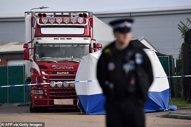 A police officer at the scene where the lorry was discovered in Grays, Essex, on October 23