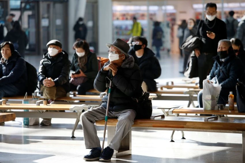 People wear masks at Seoul Station. South Korea has seen a surge in coronavirus cases.