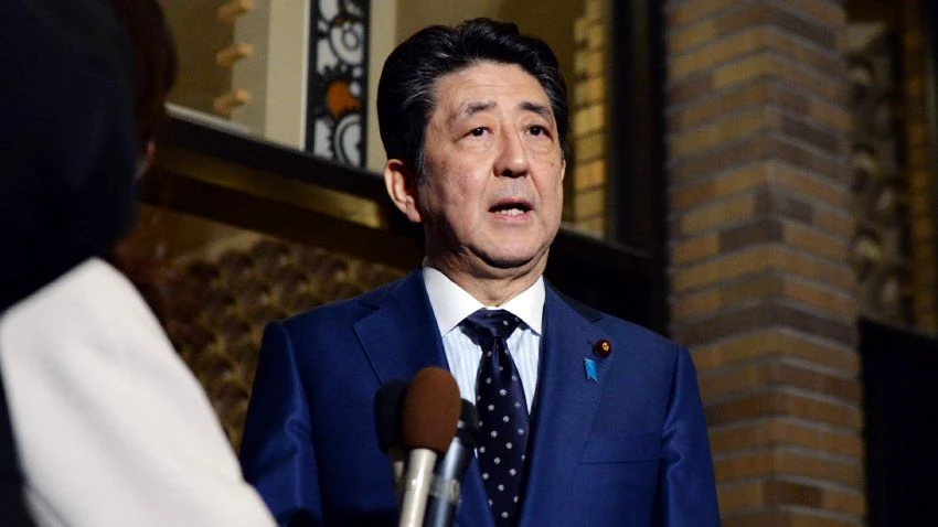 Japanese Prime Minister Shinzo Abe speaks to reporters at the prime minister's office in Tokyo after a phone call with International Olympic Committee President Thomas Bach on Tuesday. (Photo by Arisa Moriyama)
