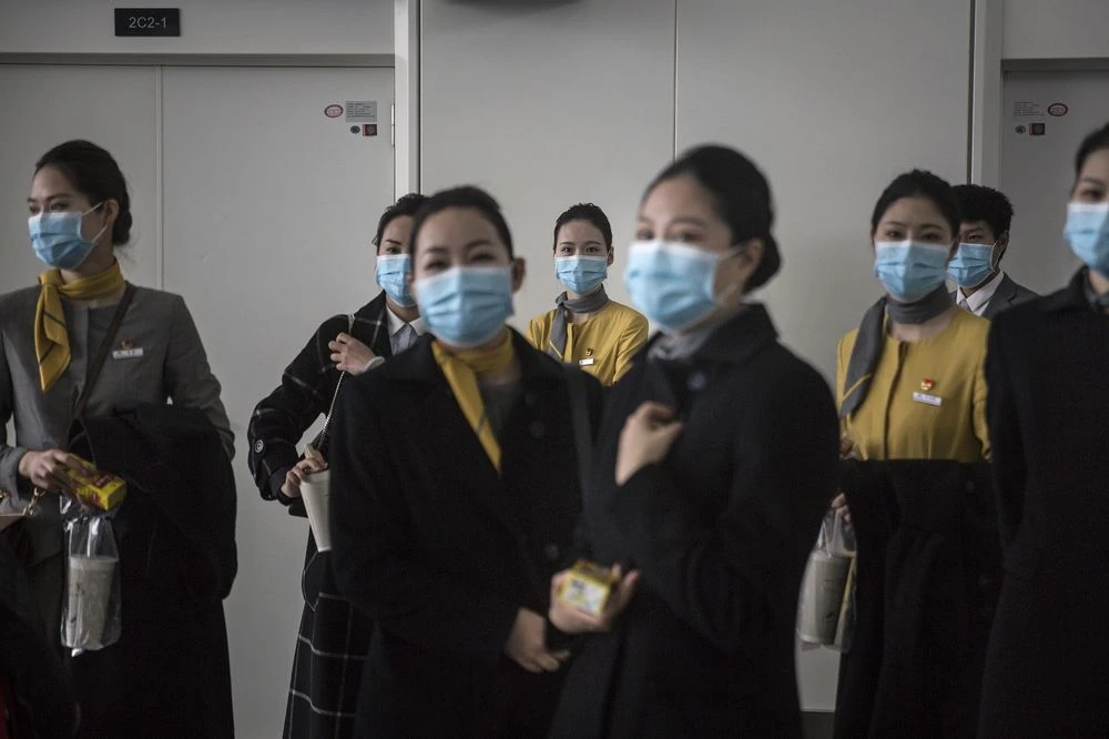 Employees stand during disinfection operations at Wuhan Tianhe International Airport, April 3. Source: Getty Images