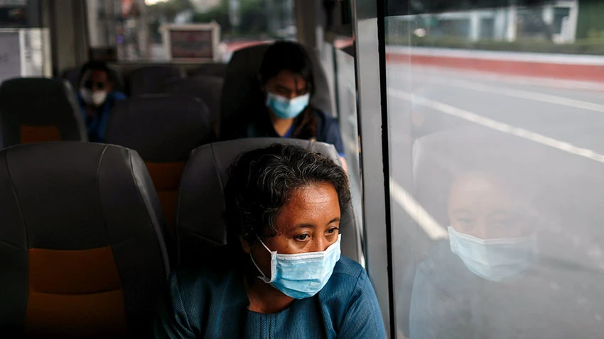 Medical workers ride a shuttle bus in Manila: Thousands leave the country every year to work overseas. © Reuters