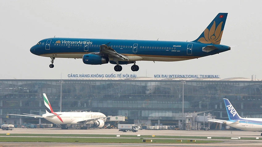 A Vietnam Airlines plane lands at Noi Bai airport in Hanoi. The carrier has suspended international service and slashed domestic flights. © Reuters
