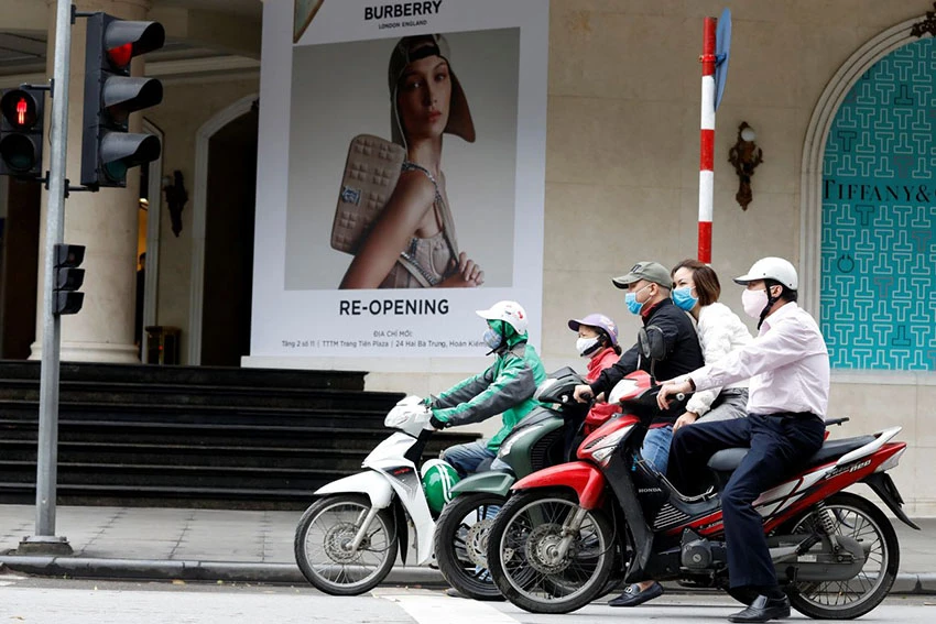 Stores in Hanoi began reopening Thursday after Vietnam eased three-week-old restrictions on movement. PHOTO: KHAM/REUTERS