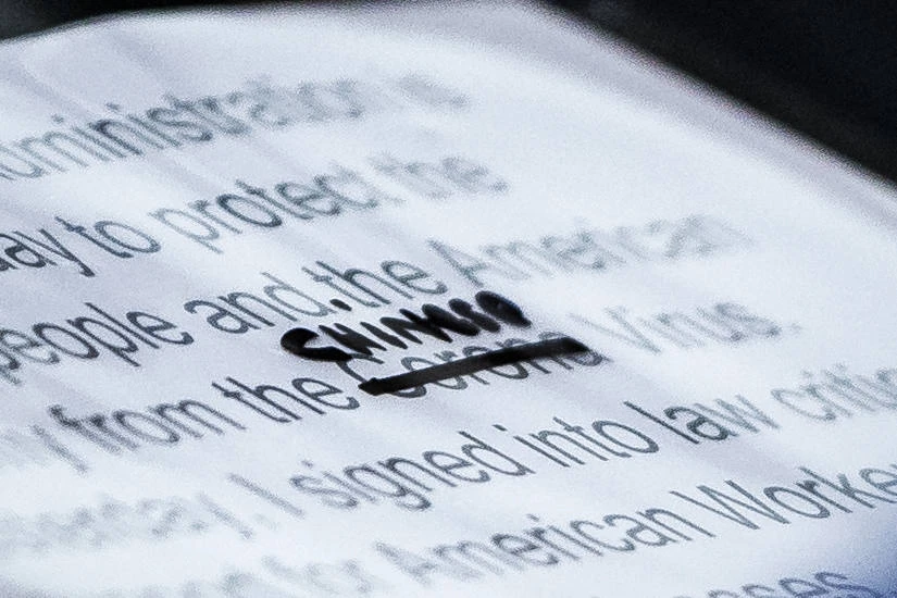 A close-up of U.S. President Donald Trump's notes shows where the word "Corona" was crossed out and replaced with "Chinese" to describe the new virus during a briefing at the White House on March 19. (Washington Post via Getty Images)