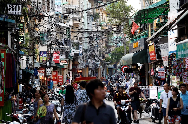 People walk down a street in the old quarter in Hanoi in this file image from June 2019 (Reuters).