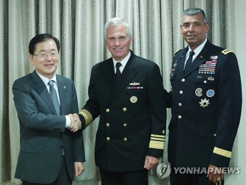 Chung Eui-yong (L), director of South Korea's presidential National Security Office, shakes hands with V. Adm. James Syring, director of the U.S. Missile Defense Agency, before their meeting in Seoul on June 5, 2017. (Photo courtesy of Cheong Wa Dae) (Yon