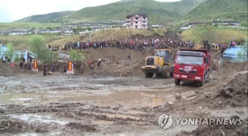 This image captured by footage from North Korea's state TV station on Sept. 16, 2016, shows North Korea's efforts to recover from massive floods that hit the country's northeastern province. (For Use Only in the Republic of Korea. No Redistribution) (Yonh