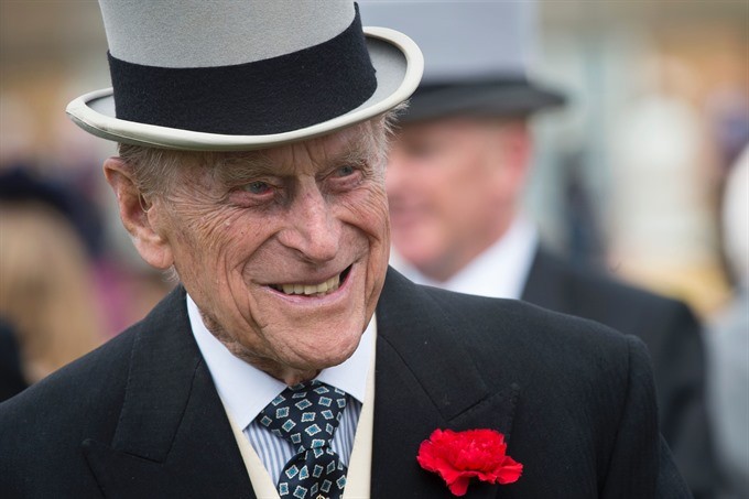 This file photo taken on May 16, 2017 shows Britain’s Prince Philip, Duke of Edinburgh greets guests at a garden party at Buckingham Palace in London. Britain’s Prince Philip, the 96-year-old husband of Queen Elizabeth II, has been a constant and mischiev