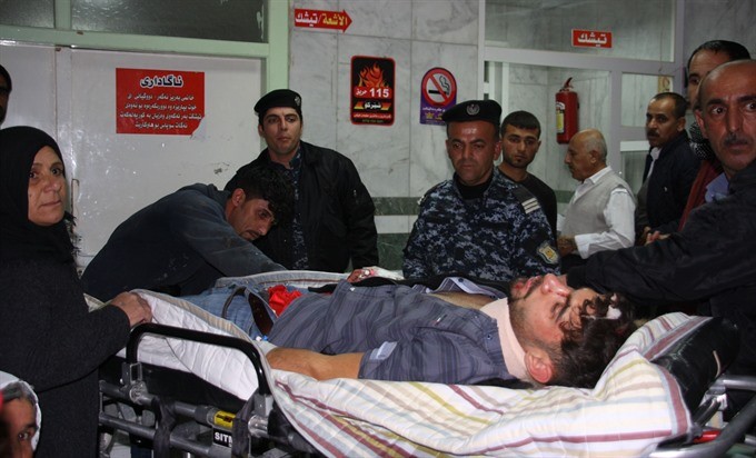An earthquake victim is aided at Sulaimaniyah Hospital on Sunday, in Sulaimaniyah, Iraq. At least 135 people were killed and hundreds more injured when a 7.3-magnitude earthquake shook the mountainous Iran-Iraq border triggering landslides that were hinde