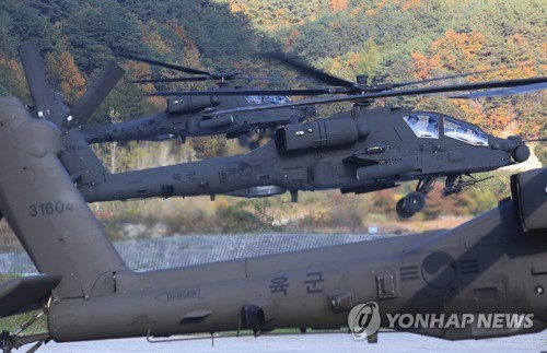 This file photo shows three South Korean Army Apache attack helicopters. (Yonhap)