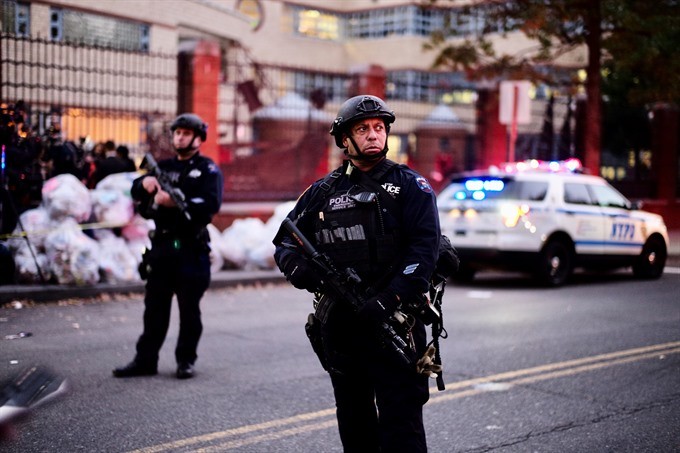 Police officers stand guard near the site of an attack in lower Manhattan in New York, the United States on October 31, 2017. Eight people were killed and a dozen more injured after a truck plowed into pedestrians near the World Trade Center in New York C