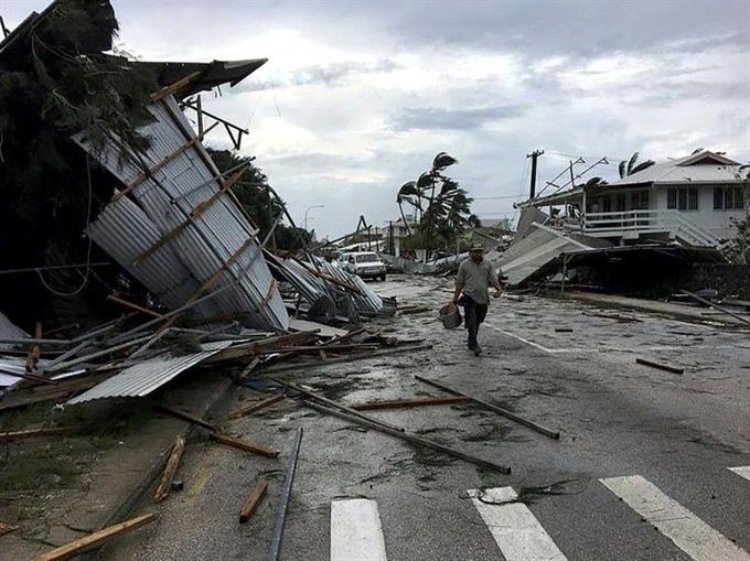 Flooding and damage in Tonga’s capital of Nuku’alofa after Cyclone Gita hit the country. — AFP/VNA Photo 