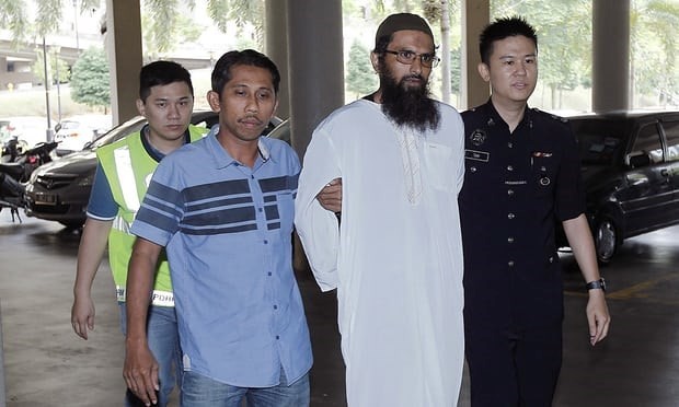 Salah Salem Saleh Sulaiman (second, right) became the first person to be convicted under Malaysia’s new anti-fake news law (Photo: AP)