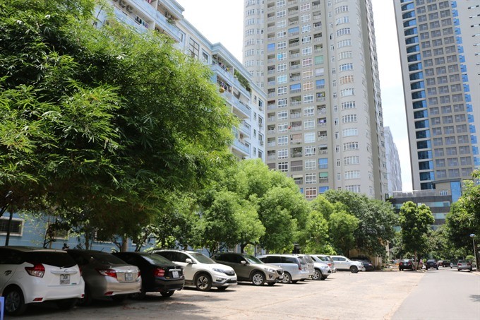 Cars parked in a play ground of apartment buildings in Trung Hòa-Nhân Chính Urban Area in Hà Nội’s Cầu Giấy District. — VNS Photo Đoàn Tùng