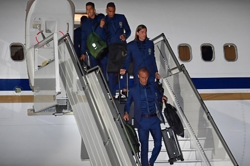 Brazil’s Firmino, Danilo, Filipe Luis and Miranda descend from the plane upon the team’s arrival at Sochi airport, in Russia on June 11, 2018, ahead of the FIFA World Cup. — AFP Photo