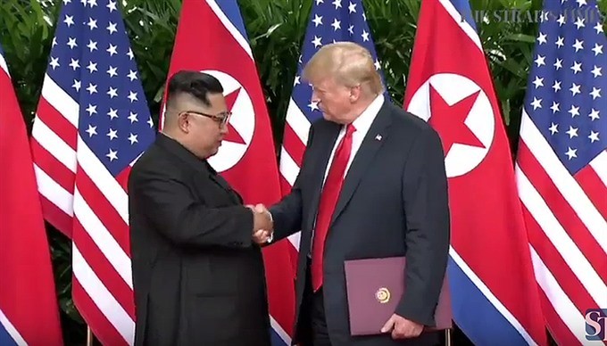 Trump, Kim sign agreementafter historic summit but few specifics