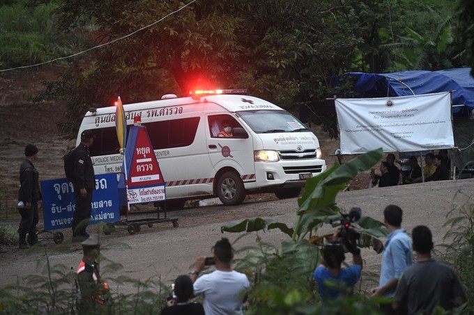 An ambulance leave the Tham Luang cave area as divers evacuated some of the 12 boys and their coach trapped at the cave in Khun Nam Nang Non Forest Park in the Mae Sai district of Chiang Rai province on Sunday. — AFP/VNA Photo