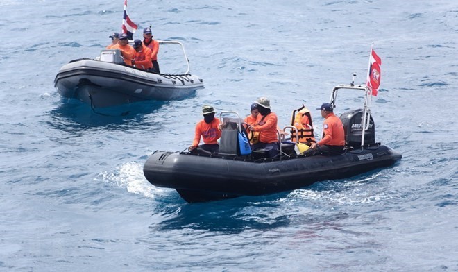 Search and rescue forces off the island (Source: VNA) 