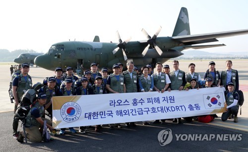 A South Korean disaster relief team comprising medical personnel leaves for Laos on July 29, 2018, to support recovery efforts for the deadly flooding that resulted from the collapse of a dam that was under construction by a Korean builder. (pool photo) (