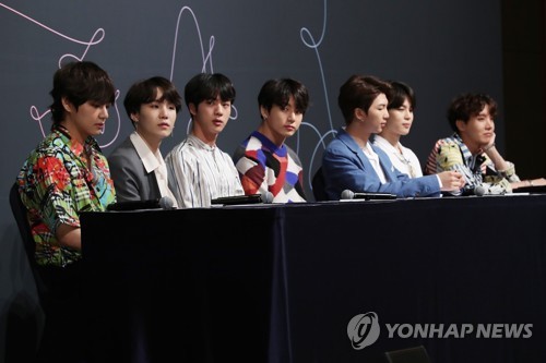 K-pop boy group BTS listens to a reporter's question during a press conference at a Seoul hotel on May 24, 2018. (Yonhap)