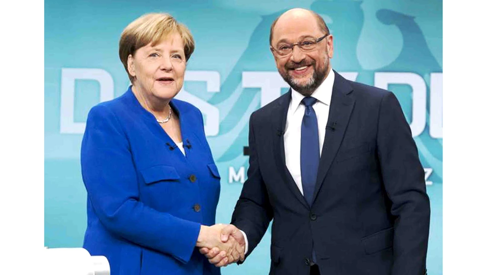 Để có được cái bắt tay với ông Martin Schulz, bà Merkel đã nhượng bộ hàng loạt yêu cầu của SPD