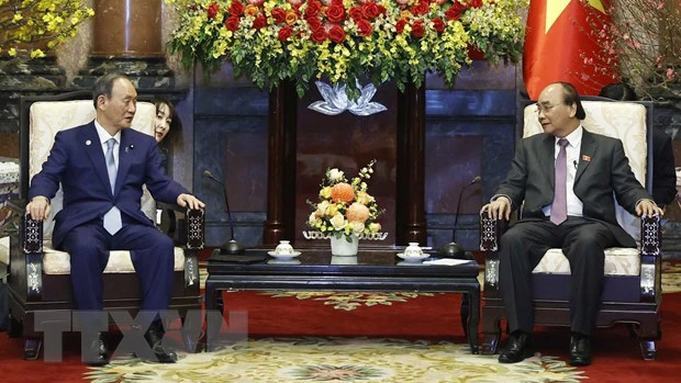 Chủ tịch nước Nguyễn Xuân Phúc tiếp nguyên Thủ tướng Nhật Bản Suga Yoshihide. Ảnh: TTXVN