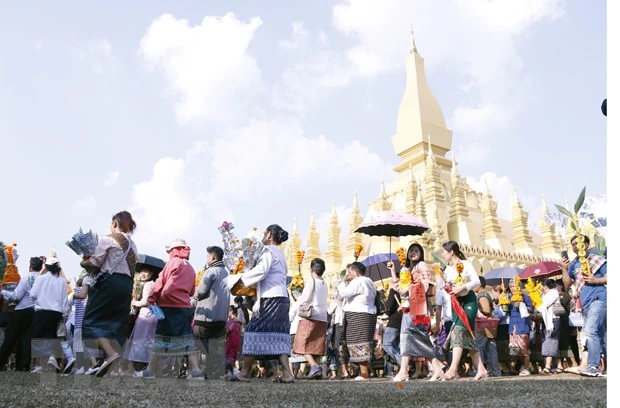 Chính phủ Lào đã quyết định tăng lương cơ bản lần thứ hai trong vòng 4 tháng. Ảnh: TTXVN