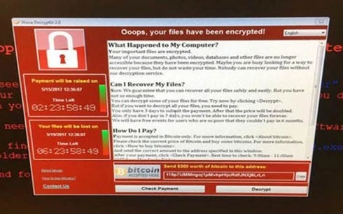 Màn hình máy tính bị tấn công mạng. (Ảnh: Indian Express)