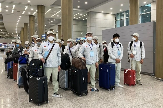 Lao động Việt Nam nhập cảnh tại sân bay Incheon (Hàn Quốc). (Ảnh: Anh Nguyên/TTXVN)